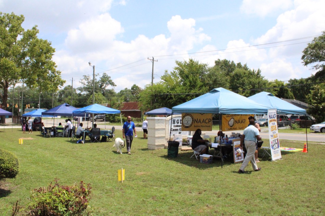 Rows of vendor tents set up on the lawn at Community Day