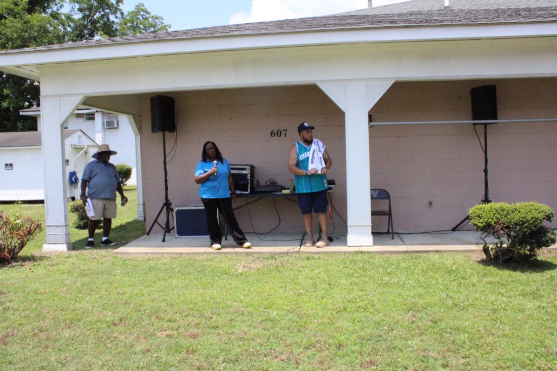 Music and announcements from the pavilion at 607 S. Slocumb Street